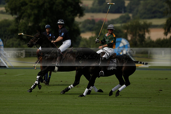 Maiz Dulce (green) v River (blue) in a Uber Polo Midsummer 12 goal polo match on Wednesday 21 August 2013 at Cowdray park Polo Club on Ambersham 2.  www.polopictures.co.uk