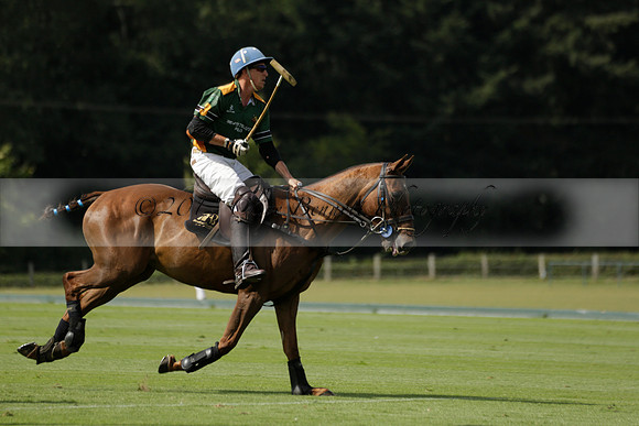 Maiz Dulce (green) v River (blue) in a Uber Polo Midsummer 12 goal polo match on Wednesday 21 August 2013 at Cowdray park Polo Club on Ambersham 2.  www.polopictures.co.uk