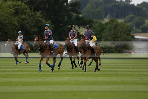 La Tremenda (lilac) v Maiz Dulce (yellow) in a Brecknock Cup polo match played on Lawns 1 at the Cowdray Park Polo Club on Tuesday 13 August 2013