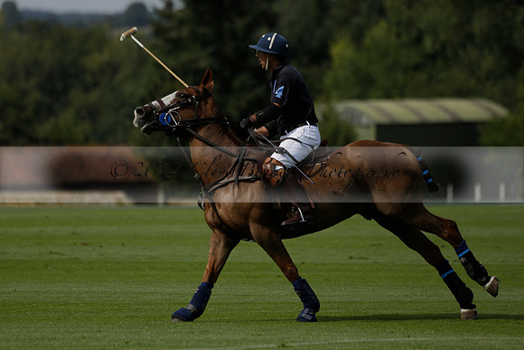 Maiz Dulce (green) v River (blue) in a Uber Polo Midsummer 12 goal polo match on Wednesday 21 August 2013 at Cowdray park Polo Club on Ambersham 2.  www.polopictures.co.uk