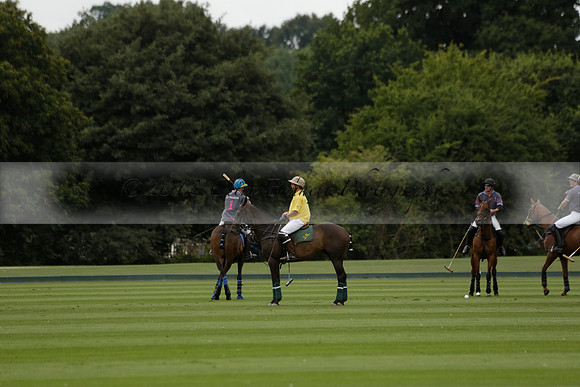 La Tremenda (lilac) v Maiz Dulce (yellow) in a Brecknock Cup polo match played on Lawns 1 at the Cowdray Park Polo Club on Tuesday 13 August 2013