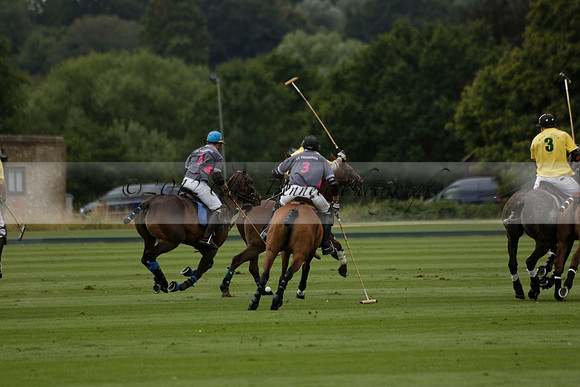 La Tremenda (lilac) v Maiz Dulce (yellow) in a Brecknock Cup polo match played on Lawns 1 at the Cowdray Park Polo Club on Tuesday 13 August 2013