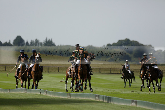 Maiz Dulce (green) v River (blue) in a Uber Polo Midsummer 12 goal polo match on Wednesday 21 August 2013 at Cowdray park Polo Club on Ambersham 2.  www.polopictures.co.uk
