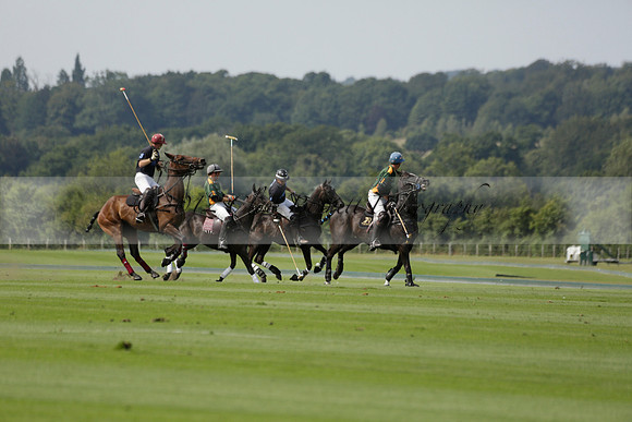Maiz Dulce (green) v River (blue) in a Uber Polo Midsummer 12 goal polo match on Wednesday 21 August 2013 at Cowdray park Polo Club on Ambersham 2.  www.polopictures.co.uk