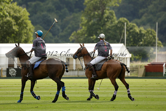 La Tremenda (lilac) v Maiz Dulce (yellow) in a Brecknock Cup polo match played on Lawns 1 at the Cowdray Park Polo Club on Tuesday 13 August 2013