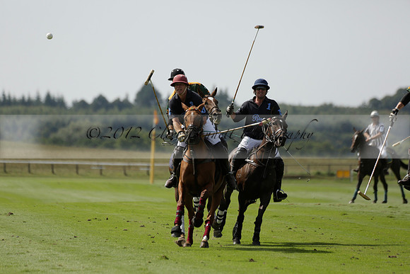 Maiz Dulce (green) v River (blue) in a Uber Polo Midsummer 12 goal polo match on Wednesday 21 August 2013 at Cowdray park Polo Club on Ambersham 2.  www.polopictures.co.uk