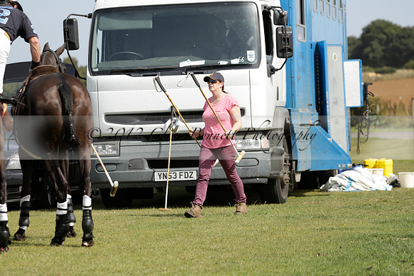 Maiz Dulce (green) v River (blue) in a Uber Polo Midsummer 12 goal polo match on Wednesday 21 August 2013 at Cowdray park Polo Club on Ambersham 2.  www.polopictures.co.uk