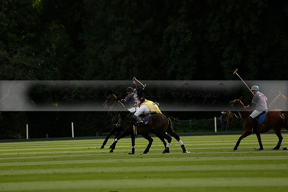 La Tremenda (lilac) v Maiz Dulce (yellow) in a Brecknock Cup polo match played on Lawns 1 at the Cowdray Park Polo Club on Tuesday 13 August 2013