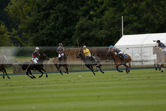 La Tremenda (lilac) v Maiz Dulce (yellow) in a Brecknock Cup polo match played on Lawns 1 at the Cowdray Park Polo Club on Tuesday 13 August 2013