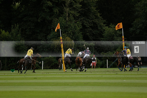 La Tremenda (lilac) v Maiz Dulce (yellow) in a Brecknock Cup polo match played on Lawns 1 at the Cowdray Park Polo Club on Tuesday 13 August 2013