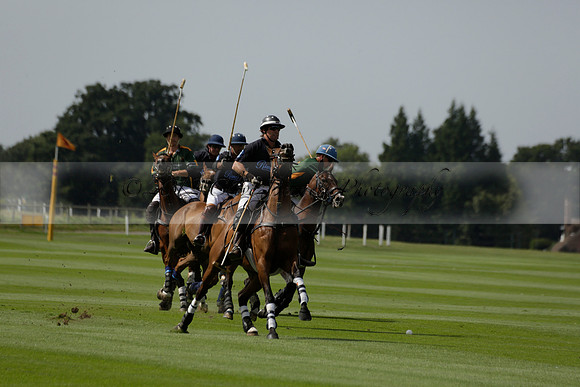 Maiz Dulce (green) v River (blue) in a Uber Polo Midsummer 12 goal polo match on Wednesday 21 August 2013 at Cowdray park Polo Club on Ambersham 2.  www.polopictures.co.uk