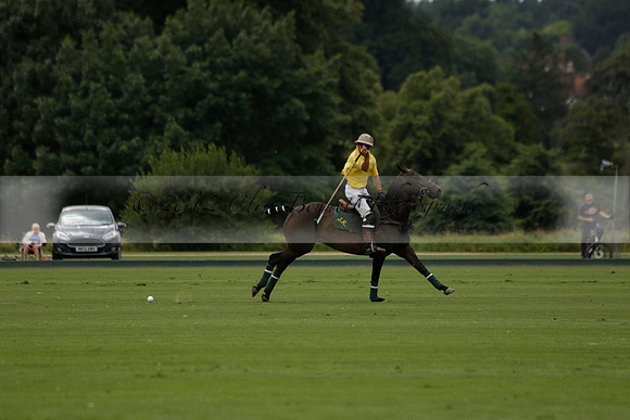 La Tremenda (lilac) v Maiz Dulce (yellow) in a Brecknock Cup polo match played on Lawns 1 at the Cowdray Park Polo Club on Tuesday 13 August 2013