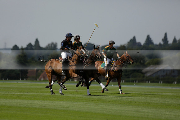Maiz Dulce (green) v River (blue) in a Uber Polo Midsummer 12 goal polo match on Wednesday 21 August 2013 at Cowdray park Polo Club on Ambersham 2.  www.polopictures.co.uk