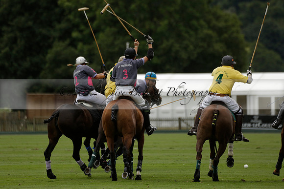 La Tremenda (lilac) v Maiz Dulce (yellow) in a Brecknock Cup polo match played on Lawns 1 at the Cowdray Park Polo Club on Tuesday 13 August 2013