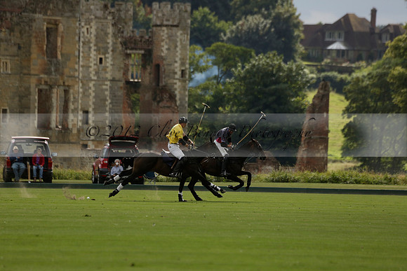 La Tremenda (lilac) v Maiz Dulce (yellow) in a Brecknock Cup polo match played on Lawns 1 at the Cowdray Park Polo Club on Tuesday 13 August 2013
