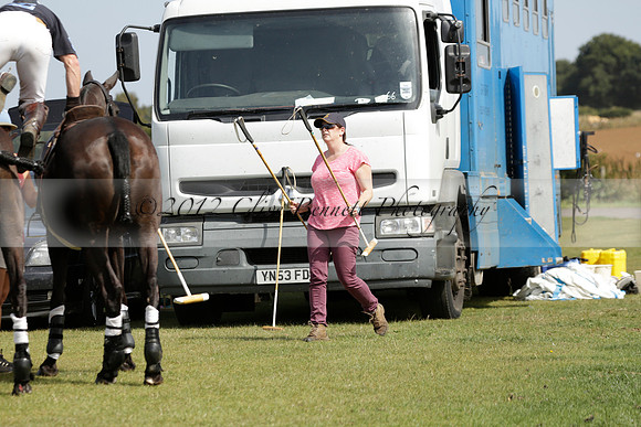 Maiz Dulce (green) v River (blue) in a Uber Polo Midsummer 12 goal polo match on Wednesday 21 August 2013 at Cowdray park Polo Club on Ambersham 2.  www.polopictures.co.uk