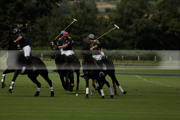 Maiz Dulce (green) v River (blue) in a Uber Polo Midsummer 12 goal polo match on Wednesday 21 August 2013 at Cowdray park Polo Club on Ambersham 2.  www.polopictures.co.uk
