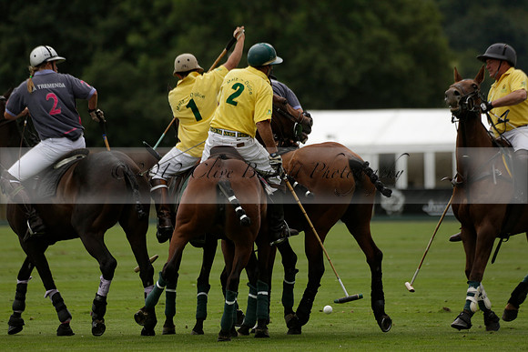 La Tremenda (lilac) v Maiz Dulce (yellow) in a Brecknock Cup polo match played on Lawns 1 at the Cowdray Park Polo Club on Tuesday 13 August 2013