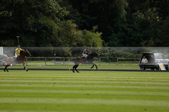 La Tremenda (lilac) v Maiz Dulce (yellow) in a Brecknock Cup polo match played on Lawns 1 at the Cowdray Park Polo Club on Tuesday 13 August 2013