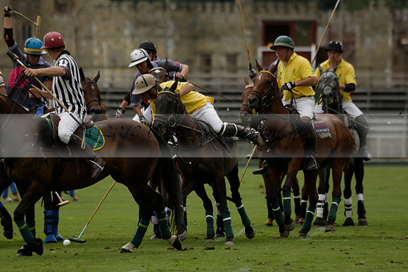 La Tremenda (lilac) v Maiz Dulce (yellow) in a Brecknock Cup polo match played on Lawns 1 at the Cowdray Park Polo Club on Tuesday 13 August 2013