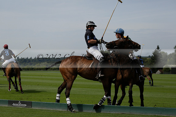 Maiz Dulce (green) v River (blue) in a Uber Polo Midsummer 12 goal polo match on Wednesday 21 August 2013 at Cowdray park Polo Club on Ambersham 2.  www.polopictures.co.uk