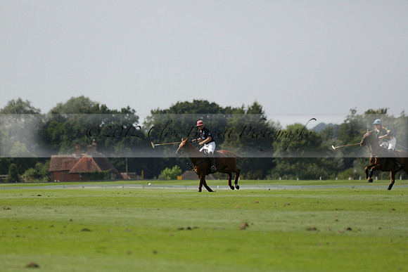 Maiz Dulce (green) v River (blue) in a Uber Polo Midsummer 12 goal polo match on Wednesday 21 August 2013 at Cowdray park Polo Club on Ambersham 2.  www.polopictures.co.uk