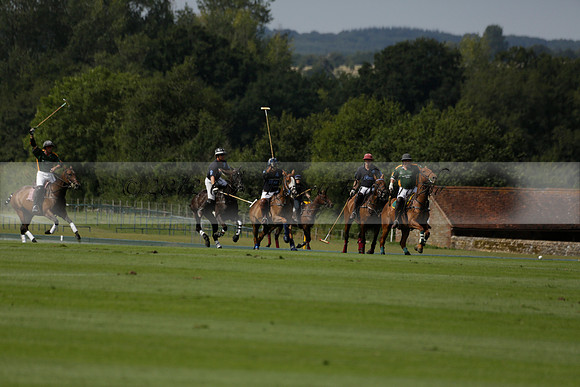 Maiz Dulce (green) v River (blue) in a Uber Polo Midsummer 12 goal polo match on Wednesday 21 August 2013 at Cowdray park Polo Club on Ambersham 2.  www.polopictures.co.uk