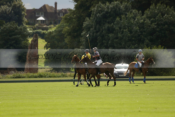 La Tremenda (lilac) v Maiz Dulce (yellow) in a Brecknock Cup polo match played on Lawns 1 at the Cowdray Park Polo Club on Tuesday 13 August 2013