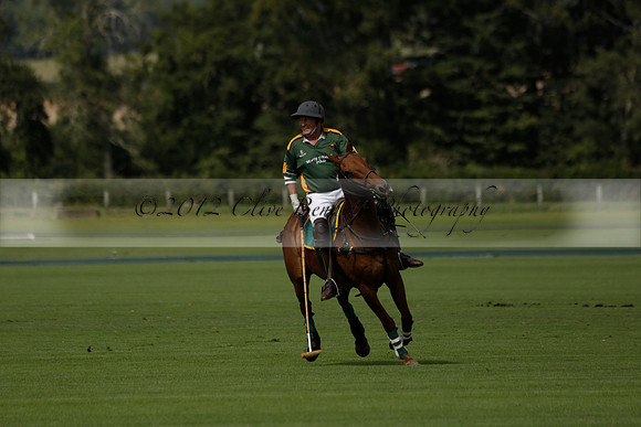 Maiz Dulce (green) v River (blue) in a Uber Polo Midsummer 12 goal polo match on Wednesday 21 August 2013 at Cowdray park Polo Club on Ambersham 2.  www.polopictures.co.uk