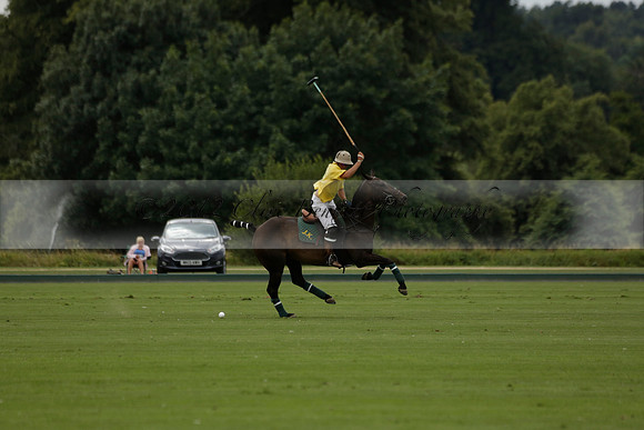La Tremenda (lilac) v Maiz Dulce (yellow) in a Brecknock Cup polo match played on Lawns 1 at the Cowdray Park Polo Club on Tuesday 13 August 2013