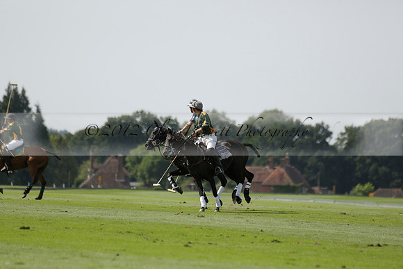 Maiz Dulce (green) v River (blue) in a Uber Polo Midsummer 12 goal polo match on Wednesday 21 August 2013 at Cowdray park Polo Club on Ambersham 2.  www.polopictures.co.uk