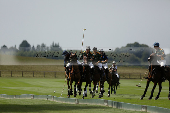 Maiz Dulce (green) v River (blue) in a Uber Polo Midsummer 12 goal polo match on Wednesday 21 August 2013 at Cowdray park Polo Club on Ambersham 2.  www.polopictures.co.uk