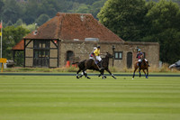 La Tremenda (lilac) v Maiz Dulce (yellow) in a Brecknock Cup polo match played on Lawns 1 at the Cowdray Park Polo Club on Tuesday 13 August 2013