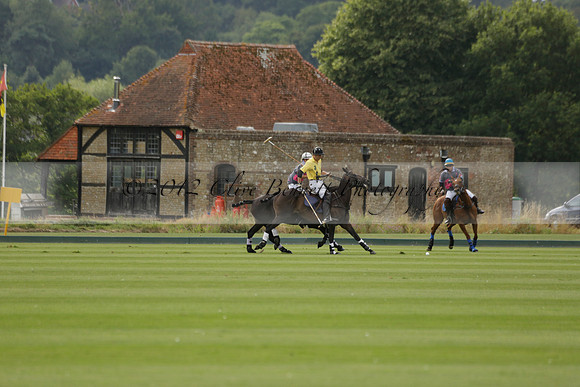 La Tremenda (lilac) v Maiz Dulce (yellow) in a Brecknock Cup polo match played on Lawns 1 at the Cowdray Park Polo Club on Tuesday 13 August 2013