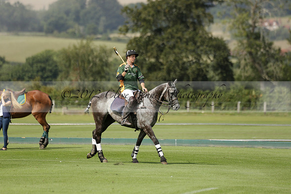 Maiz Dulce (green) v River (blue) in a Uber Polo Midsummer 12 goal polo match on Wednesday 21 August 2013 at Cowdray park Polo Club on Ambersham 2.  www.polopictures.co.uk