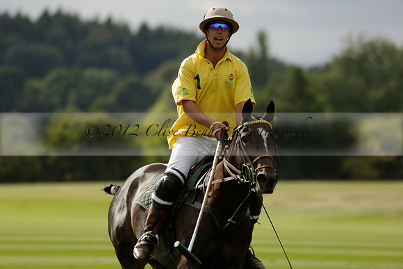 La Tremenda (lilac) v Maiz Dulce (yellow) in a Brecknock Cup polo match played on Lawns 1 at the Cowdray Park Polo Club on Tuesday 13 August 2013