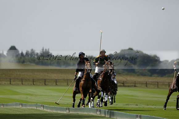 Maiz Dulce (green) v River (blue) in a Uber Polo Midsummer 12 goal polo match on Wednesday 21 August 2013 at Cowdray park Polo Club on Ambersham 2.  www.polopictures.co.uk