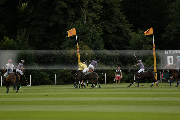 La Tremenda (lilac) v Maiz Dulce (yellow) in a Brecknock Cup polo match played on Lawns 1 at the Cowdray Park Polo Club on Tuesday 13 August 2013