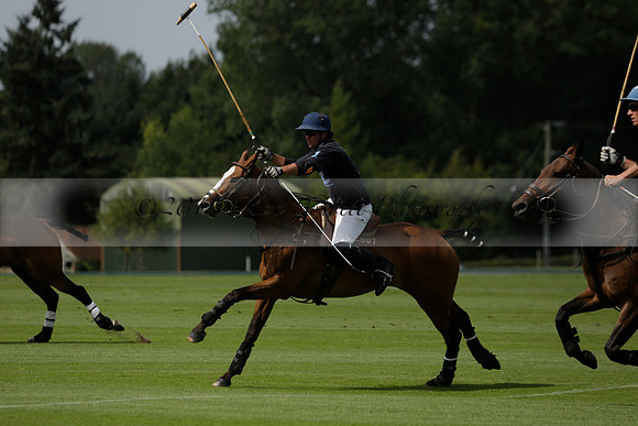 Maiz Dulce (green) v River (blue) in a Uber Polo Midsummer 12 goal polo match on Wednesday 21 August 2013 at Cowdray park Polo Club on Ambersham 2.  www.polopictures.co.uk
