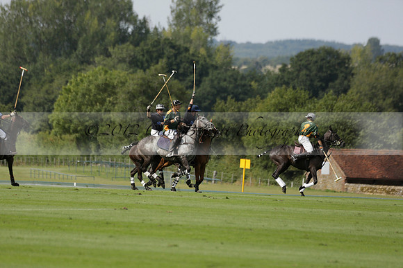 Maiz Dulce (green) v River (blue) in a Uber Polo Midsummer 12 goal polo match on Wednesday 21 August 2013 at Cowdray park Polo Club on Ambersham 2.  www.polopictures.co.uk