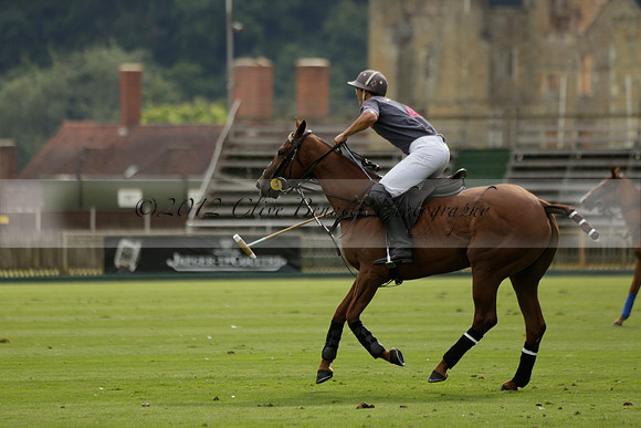 La Tremenda (lilac) v Maiz Dulce (yellow) in a Brecknock Cup polo match played on Lawns 1 at the Cowdray Park Polo Club on Tuesday 13 August 2013