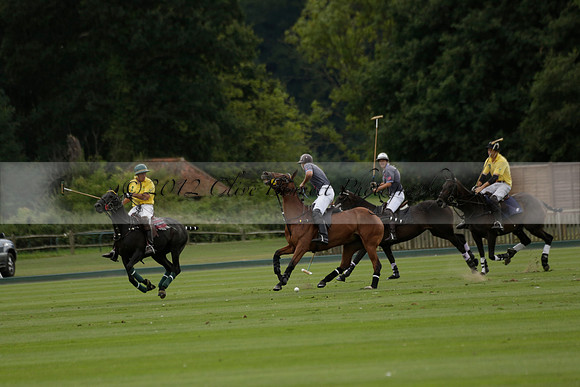 La Tremenda (lilac) v Maiz Dulce (yellow) in a Brecknock Cup polo match played on Lawns 1 at the Cowdray Park Polo Club on Tuesday 13 August 2013