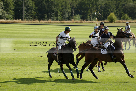 Pandas (white) v Home Farm (navy) in a Park House West Sussex Cup Polo match on Brooksfield at Cowdray Park Polo Club on Friday 30 August 2013. 2013.08.30 www.polopictures.co.uk