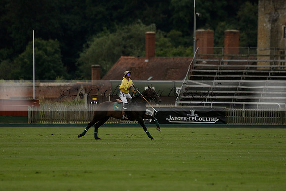 La Tremenda (lilac) v Maiz Dulce (yellow) in a Brecknock Cup polo match played on Lawns 1 at the Cowdray Park Polo Club on Tuesday 13 August 2013