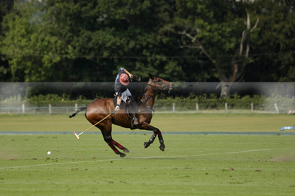 Maiz Dulce (green) v River (blue) in a Uber Polo Midsummer 12 goal polo match on Wednesday 21 August 2013 at Cowdray park Polo Club on Ambersham 2.  www.polopictures.co.uk