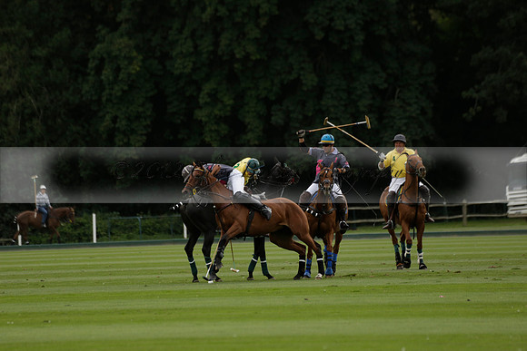 La Tremenda (lilac) v Maiz Dulce (yellow) in a Brecknock Cup polo match played on Lawns 1 at the Cowdray Park Polo Club on Tuesday 13 August 2013