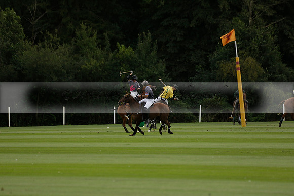 La Tremenda (lilac) v Maiz Dulce (yellow) in a Brecknock Cup polo match played on Lawns 1 at the Cowdray Park Polo Club on Tuesday 13 August 2013
