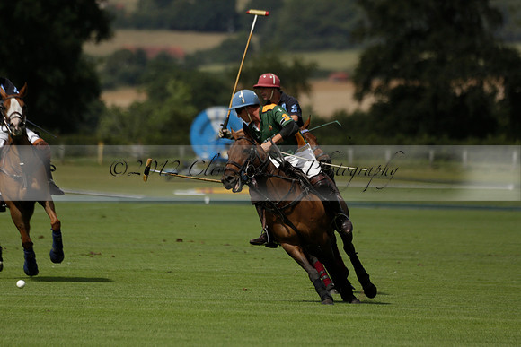 Maiz Dulce (green) v River (blue) in a Uber Polo Midsummer 12 goal polo match on Wednesday 21 August 2013 at Cowdray park Polo Club on Ambersham 2.  www.polopictures.co.uk