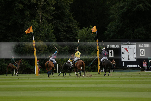 La Tremenda (lilac) v Maiz Dulce (yellow) in a Brecknock Cup polo match played on Lawns 1 at the Cowdray Park Polo Club on Tuesday 13 August 2013
