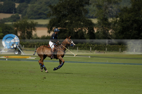Maiz Dulce (green) v River (blue) in a Uber Polo Midsummer 12 goal polo match on Wednesday 21 August 2013 at Cowdray park Polo Club on Ambersham 2.  www.polopictures.co.uk